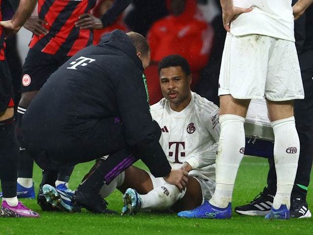 Bayern Munich's Serge Gnabry receives medical attention on December 9, 2023