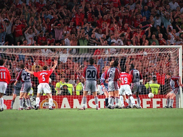 Manchester United players celebrate Ole Gunnar Solskjaer's goal against Bayern Munich on May 26, 1999
