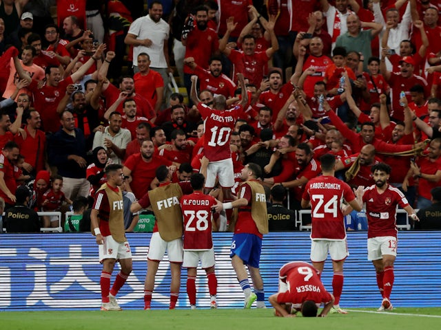Al Ahly's Hussein El-Shahat celebrates scoring their second goal with teammates on December 15, 2023