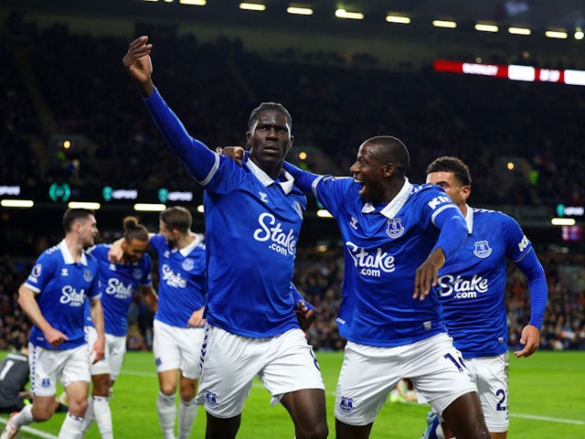 Everton's Amadou Onana celebrates scoring their first goal with Abdoulaye Doucoure on December 16, 2023