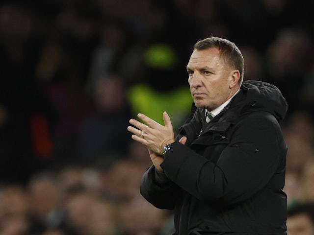 Celtic manager Brendan Rodgers applauds fans after the match on December 13, 2023