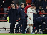 Tottenham Hotspur's Brennan Johnson with manager Ange Postecoglou after being substituted due to an injury on December 15, 2023