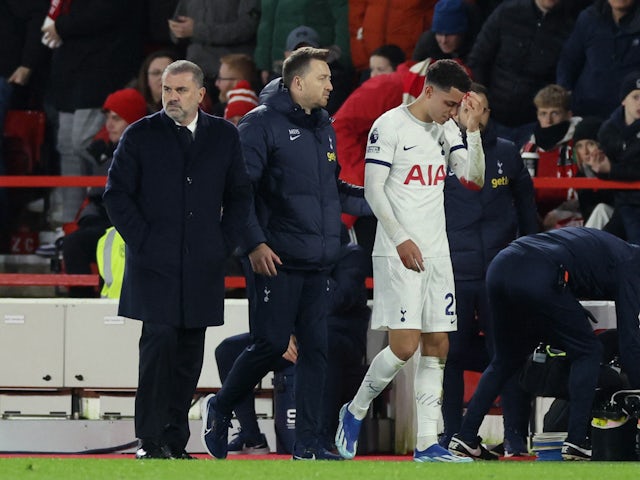 Tottenham Hotspur's Brennan Johnson with manager Ange Postecoglou after being substituted due to an injury on December 15, 2023