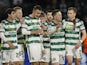 Celtic's Callum McGregor celebrates with teammates after the match on December 13, 2023