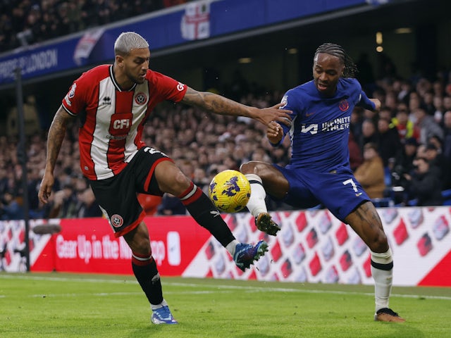 Chelsea's Raheem Sterling in action with Sheffield United's Vini Souza on December 16, 2023