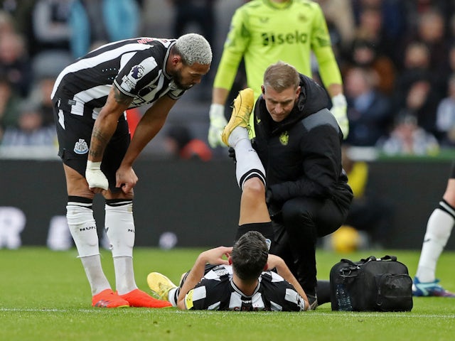 Newcastle United's Fabian Schar receives medical attention after sustaining an injury on December 16, 2023