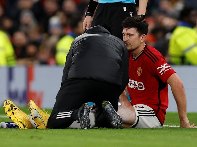 Manchester United's Harry Maguire receives medical attention after sustaining an injury on December 12, 2023