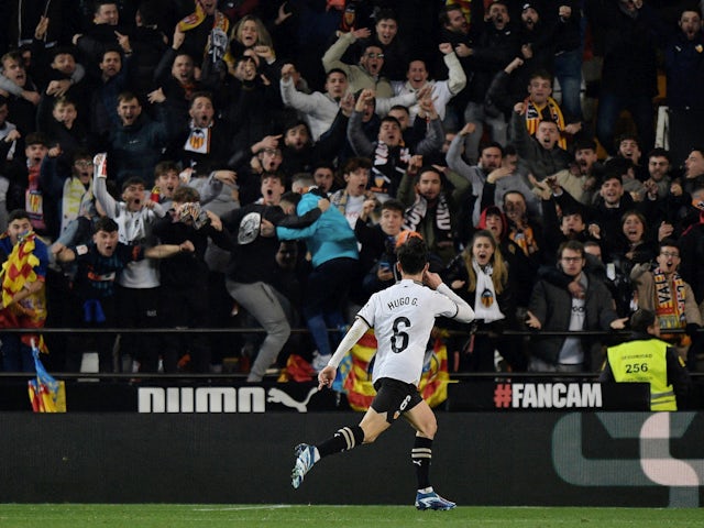 Valencia's Hugo Guillamon celebrates scoring their first goal on December 16, 2023