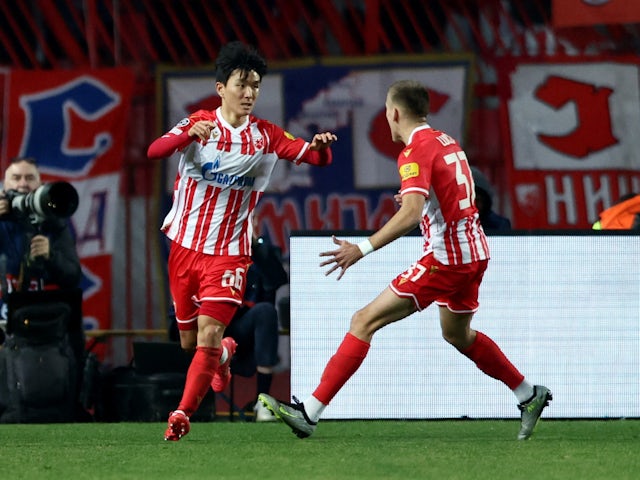 Red Star Belgrade's Hwang In-beom celebrates scoring their first goal with Vladimir Lucic on December 13, 2023