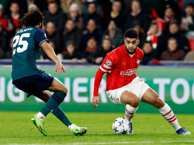 PSV Eindhoven's Ismael Saibari in action with Arsenal's Mohamed Elneny on December 12, 2023