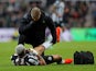 Newcastle United's Joelinton receives medical attention after sustaining an injury on December 16, 2023