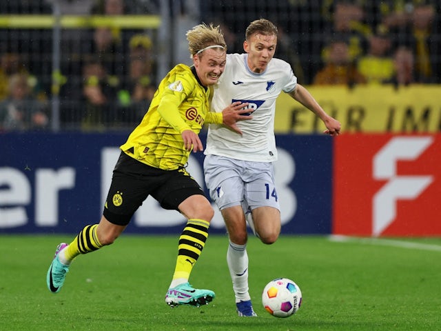 Borussia Dortmund's Julian Brandt in action with Hoffenheim's Maximilian Beier on November 1, 2023