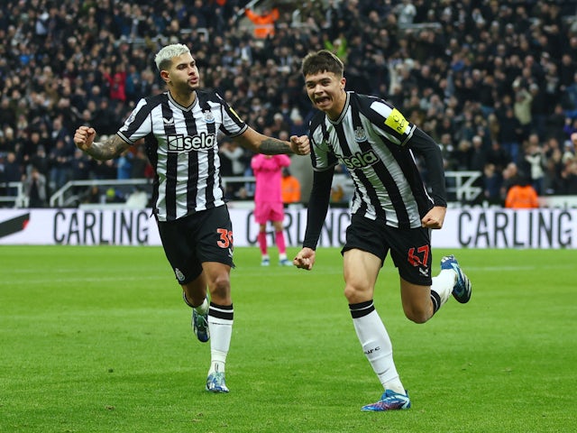 Newcastle United's Lewis Miley celebrates scoring their first goal with Bruno Guimaraes on December 16, 2023