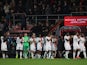Luton Town players applaud fans after the match is suspended on December 16, 2023