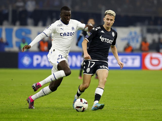 Olympique de Marseille's Pape Gueye in action with AS Monaco's Aleksandr Golovin on January 28, 2023