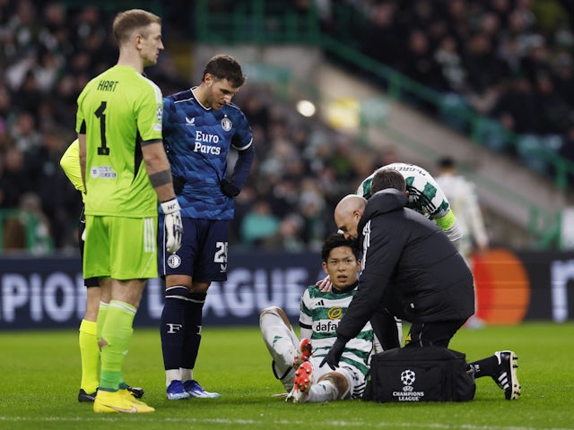 Celtic's Tomoki Iwata receives medical attention after sustaining an injury on December 13, 2023