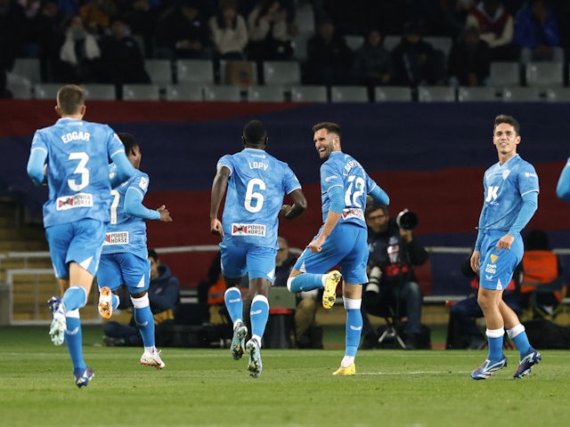 Almeria's Leo Baptistao celebrates scoring their first goal with teammates on December 19, 2023