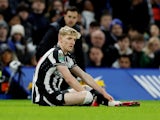 Newcastle United's Anthony Gordon reacts after sustaining an injury on December 19, 2023