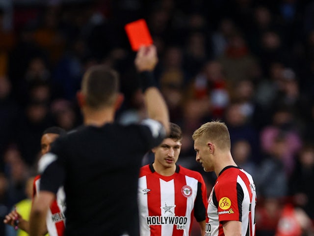 Brentford's Ben Mee is shown a red card by referee David Coote on December 17, 2023