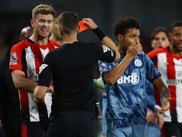 Aston Villa's Boubacar Kamara is shown a red card by referee David Coote on December 17, 2023