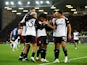 Fulham's Rodrigo Muniz and Willian celebrate their first goal with teammates on December 19, 2023