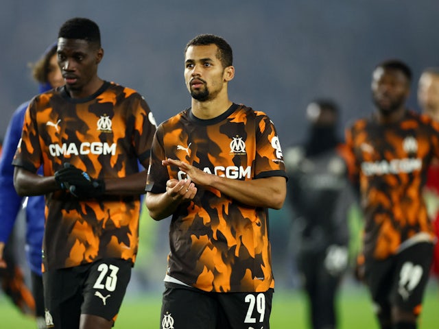 Olympique de Marseille's Iliman Ndiaye and Ismaila Sarr look dejected after the match on December 14, 2023