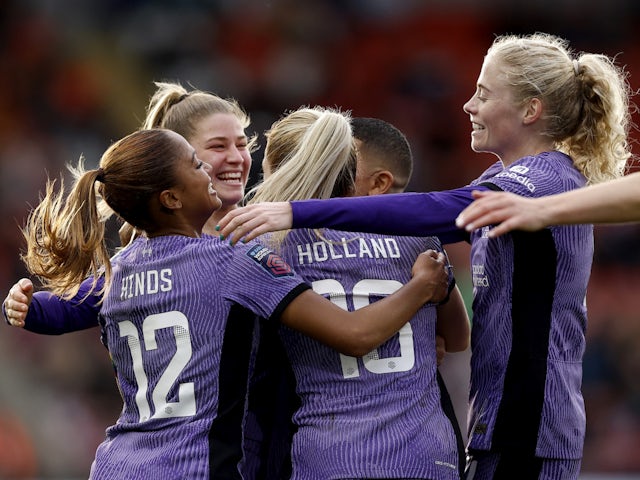 Liverpool Women's Taylor Hinds celebrates scoring their second goal with teammates on December 17, 2023