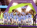 General view as Manchester City's Kyle Walker lifts the trophy alongside teammates after winning the Club World Cup final on December 22, 2023