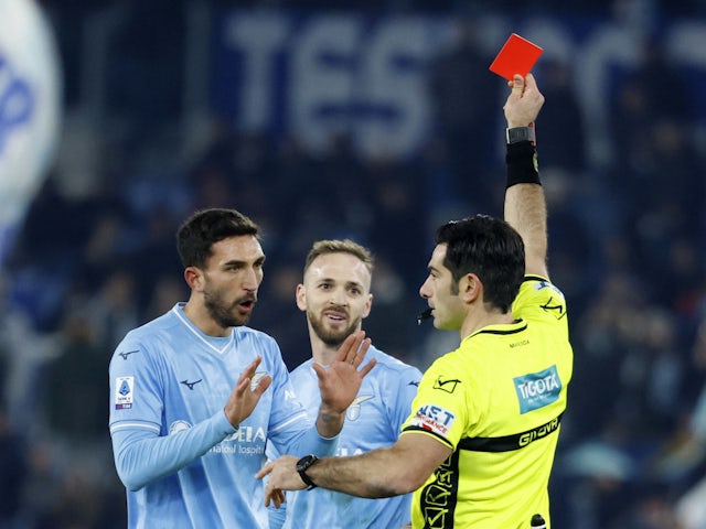 Lazio's Manuel Lazzari is shown a red card by referee Fabio Maresca on December 17, 2023