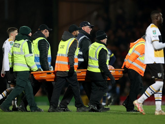 Port Vale's Oliver Arblaster is brought off the pitch after sustaining an injury on December 19, 2023