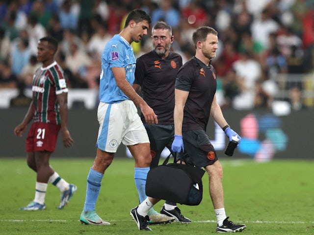 Manchester City's Rodri walks of the pitch to receive medical attention after sustaining an injury on December 22, 2023