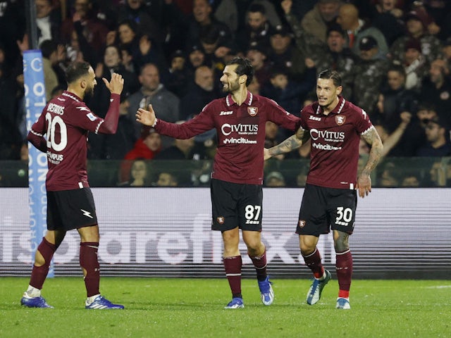 Salernitana's Antonio Candreva celebrates scoring their second goal with Pasquale Mazzocchi and Grigoris Kastanos on December 22, 2023
