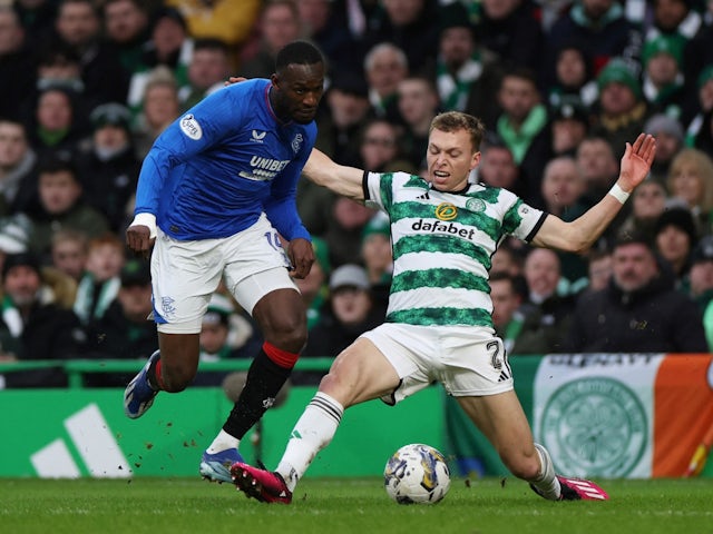 Celtic's Alistair Johnston in action with Rangers' Abdallah Sima on December 30, 2023