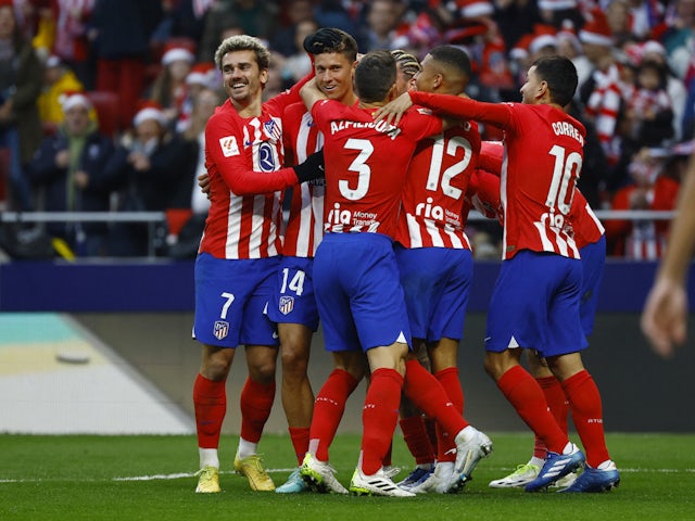 Atletico Madrid's Marcos Llorente celebrates scoring their first goal with teammates on December 23, 2023