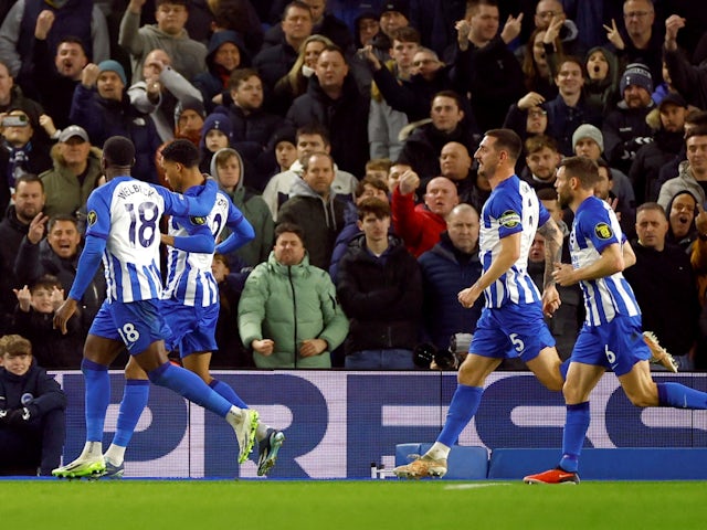 Brighton & Hove Albion's Joao Pedro celebrates scoring their second goal with teammates on December 28, 2023
