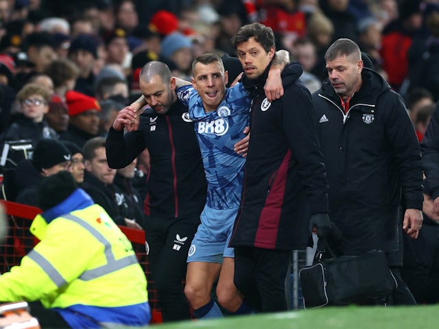Aston Villa's Lucas Digne is helped off the field after sustaining an injury on December 26, 2023