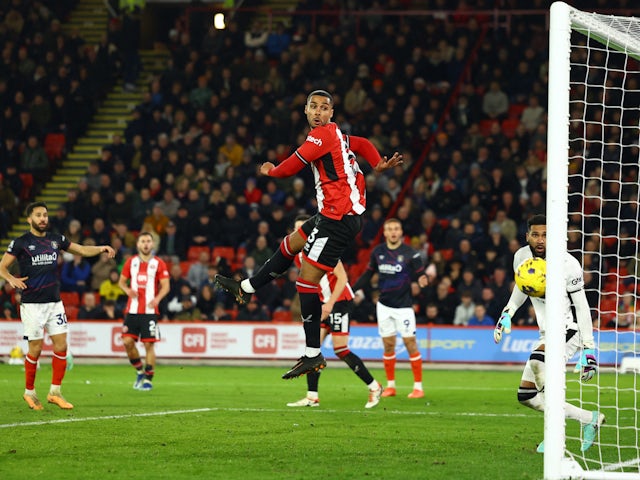 Sheffield United's Max Lowe looks on as Anis Ben Slimane scores an own goal on December 26, 2023
