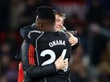 Manchester United's Rasmus Hojlund and Andre Onana celebrate after the match on December 26, 2023