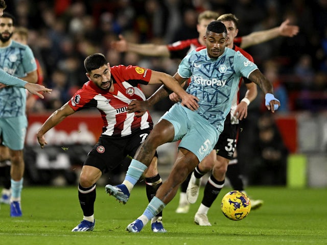 Brentford's Neal Maupay in action with Wolverhampton Wanderers' Mario Lemina on December 27, 2023