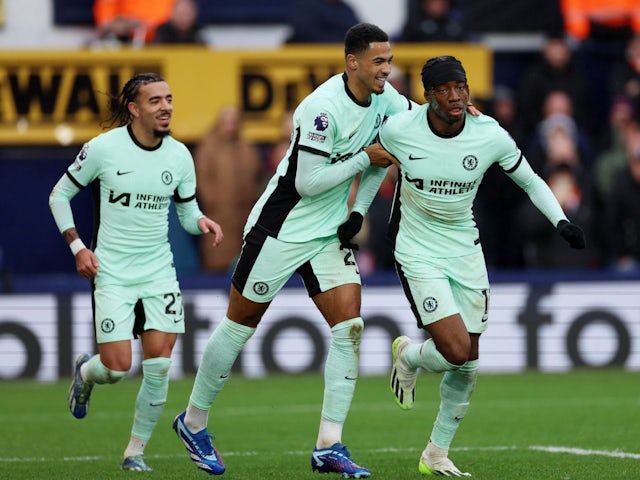 Chelsea's Noni Madueke celebrates scoring their second goal with Levi Colwill and Malo Gusto on December 30, 2023