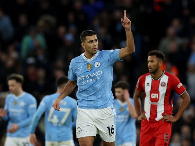 Man City beat Sheffield United to close in on leaders Liverpool