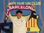 Barcelona's Vitor Roque holds up a scarf during the unveiling on December 27, 2023