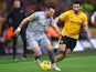 Everton's Jack Harrison in action with Wolverhampton Wanderers' Rayan Ait-Nouri on December 30, 2023