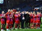 Aldershot manager Tommy Widdrington and players applaud fans after the match on January 7, 2024