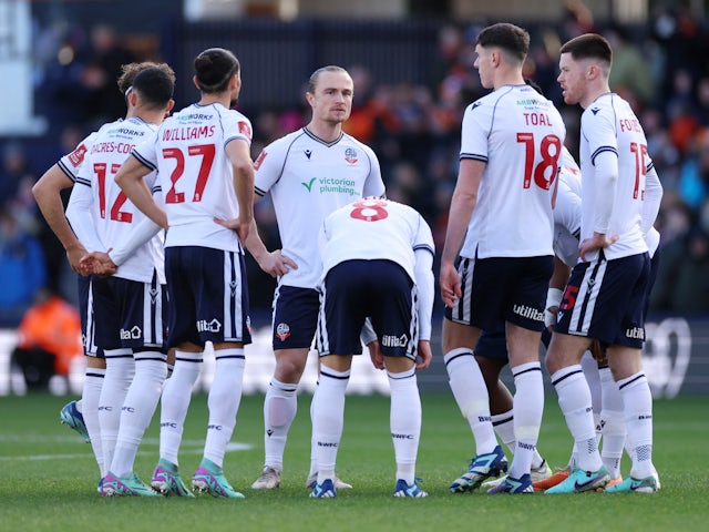 Bolton Wanderers' Kyle Dempsey and teammates before the match on January 7, 2024