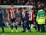 Brentford's Christian Norgaard leaves the pitch after sustaining an injury on January 5, 2024