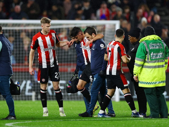 Brentford's Christian Norgaard leaves the pitch after sustaining an injury on January 5, 2024