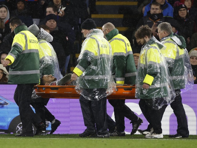 Everton's Dwight McNeil is stretchered off after sustaining an injury on January 4, 2024