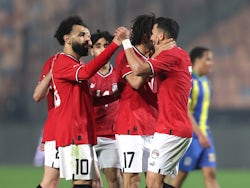 Egypt's Trezeguet celebrates scoring their first goal with Mohamed Salah and teammates on January 7, 2024