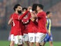 Egypt's Trezeguet celebrates scoring their first goal with Mohamed Salah and teammates on January 7, 2024